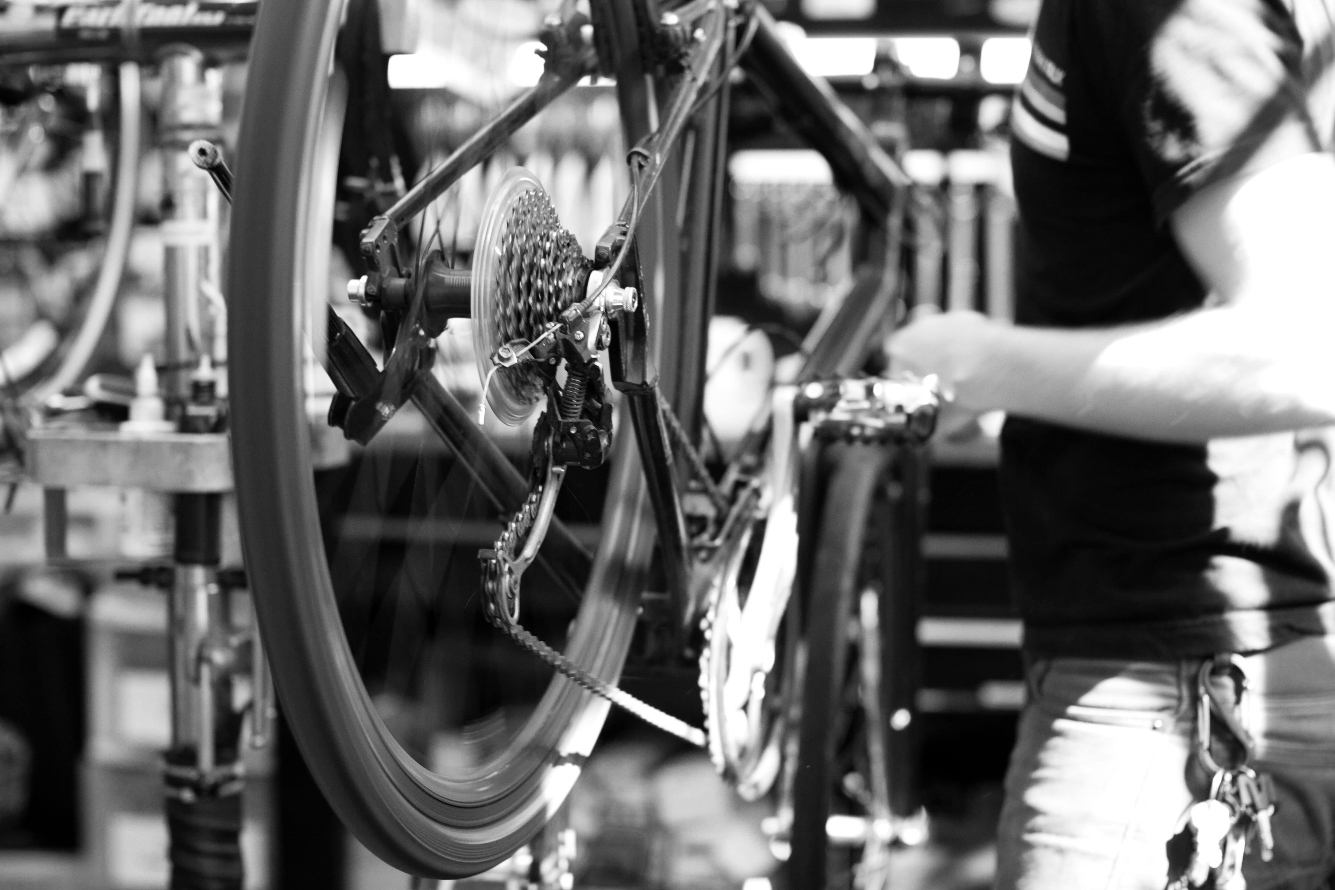 A mechanic working on a bike.